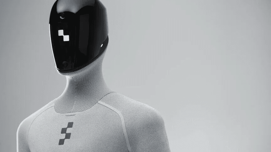 A humanoid robot with a glossy black visor for a face and a light grey knitted body, against a plain grey background