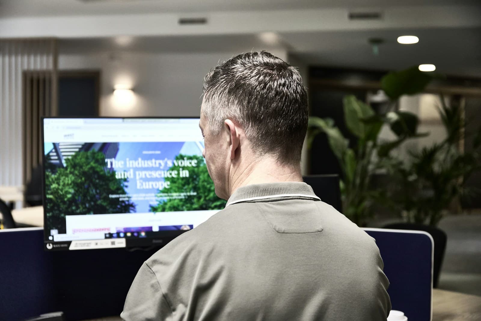 A man working at a computer in an office